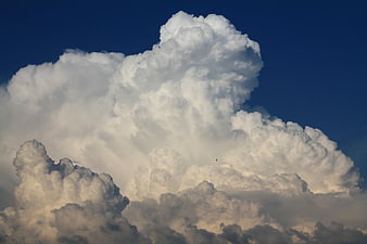 Majestic Cumulonimbus Cloud Formation Against Deep Blue Sky