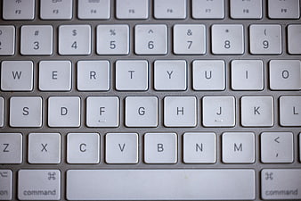 Close-up of white laptop keyboard keys