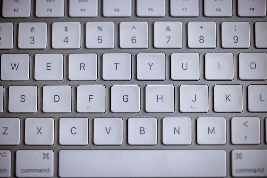 Close-up of white laptop keyboard keys