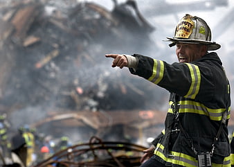 Firefighter Deputy Chief Pointing at Rubble