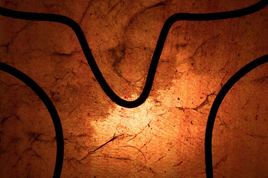 Abstract orange textured background with black wavy lines