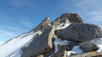 Snowy Mountain Peak with Large Granite Boulders