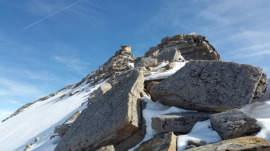 Snowy Mountain Peak with Large Granite Boulders