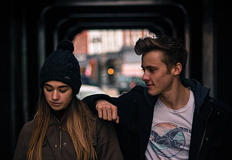 Young Couple Walking Through Urban Tunnel