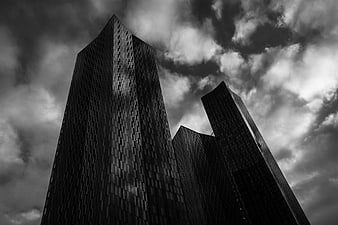 Dramatic Black and White Skyscrapers Against Cloudy Sky