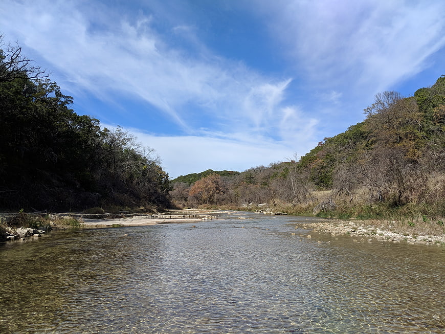 Scenic River Landscape with Blue Sky and Autumn Trees