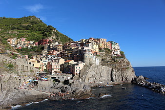 Colorful houses on cliffs in Manarola, Cinque Terre, Italy