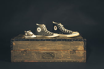Vintage Converse All Star Sneakers on Antique Wooden Chest