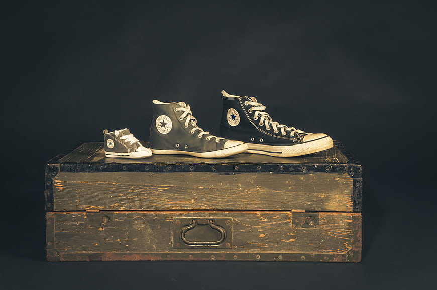 Vintage Converse All Star Sneakers on Antique Wooden Chest