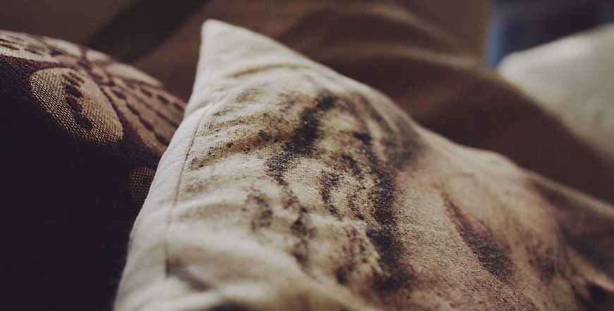Close-up of textured beige and brown decorative throw pillows
