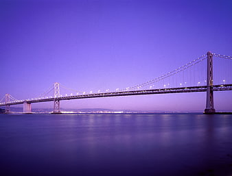 San Francisco Bay Bridge at twilight with purple sky