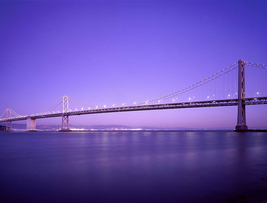 San Francisco Bay Bridge at twilight with purple sky
