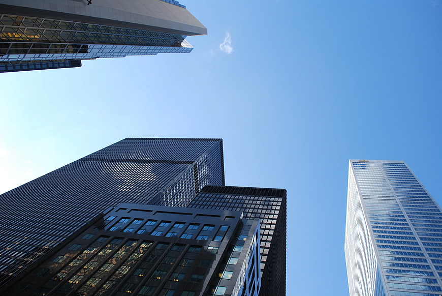 Worms eye view of modern skyscrapers against blue sky