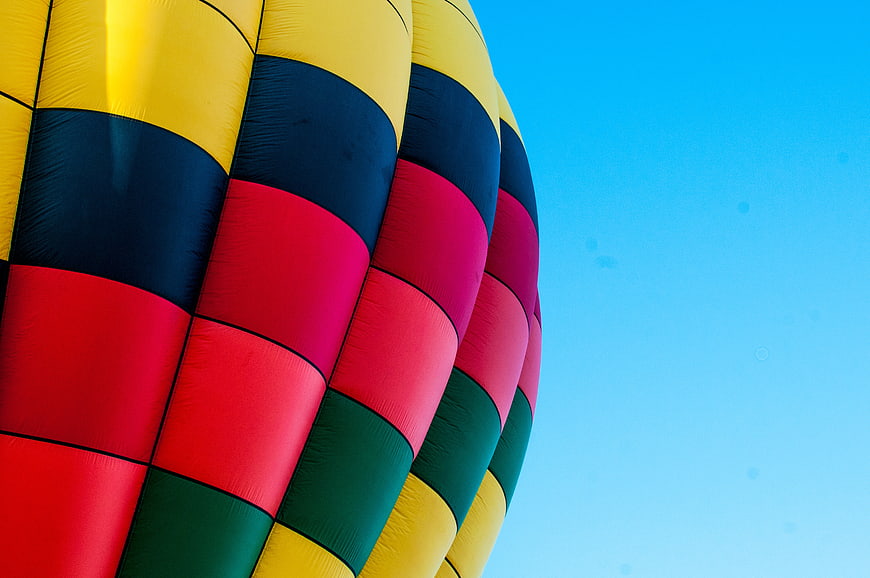 Colorful Hot Air Balloon Close-Up Against Blue Sky