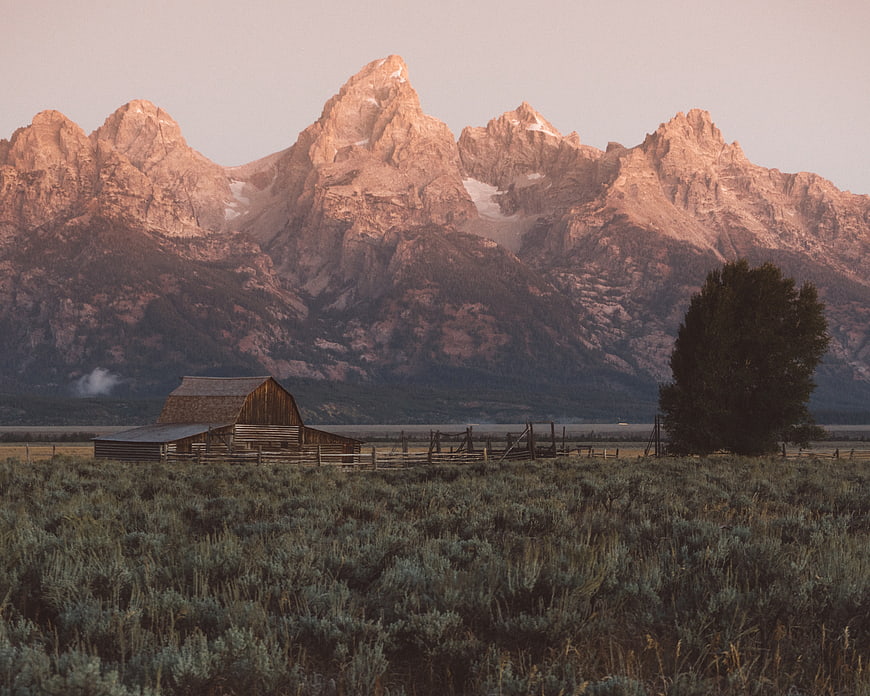 Mormon Row Barn with Grand Teton Mountains at Sunset