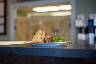 Gourmet Sandwich on Plate in Cafe Setting