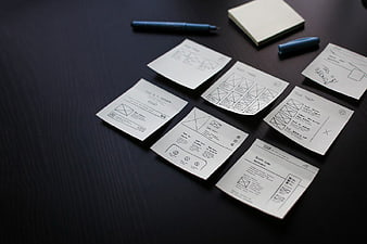 UX Wireframe Sketches on Dark Desk