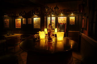 Dimly Lit Traditional Irish Pub Interior With Beer Bottles And Vintage Posters