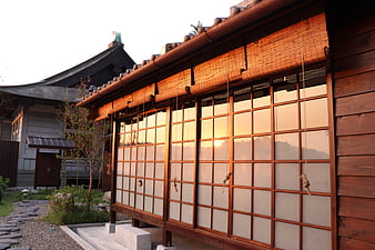 Traditional Japanese Architecture with Shoji Screens at Sunset