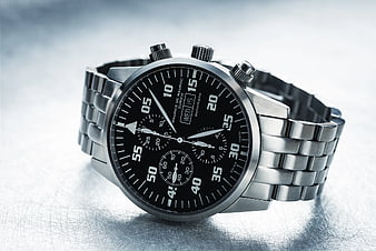 Silver Chronograph Watch on Metal Surface