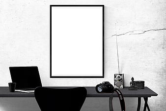 Minimalist Black and White Office Desk with Blank Poster Frame