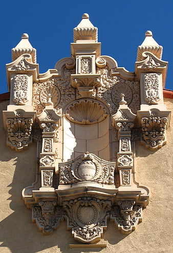 Ornate Baroque Plaster Facade Detail Against Blue Sky