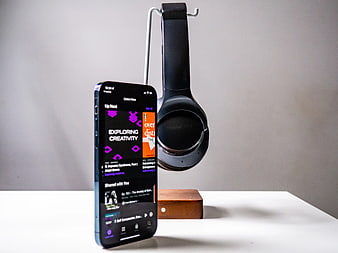 Smartphone and Headphones on Minimalist White Desk