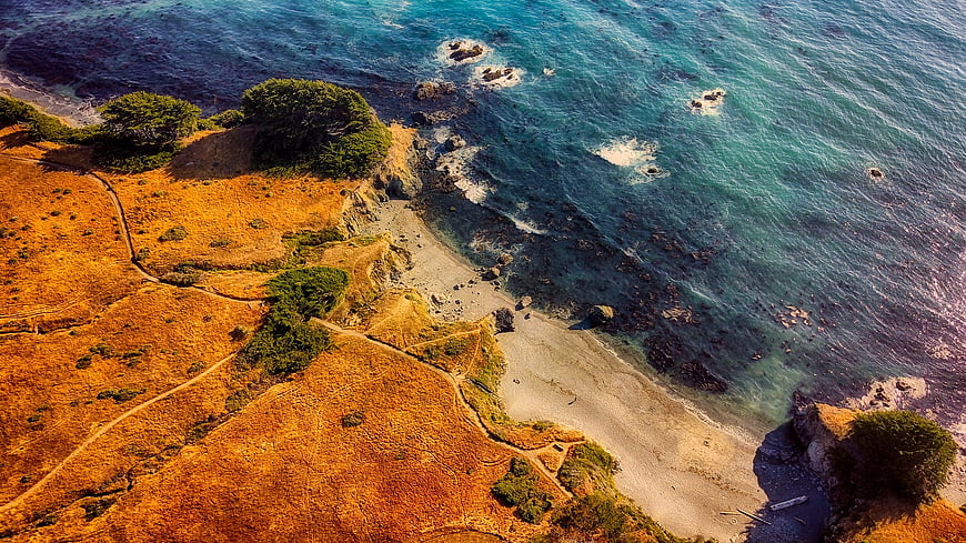Aerial View of Golden California Coastline and Turquoise Ocean