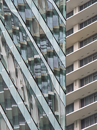 Modern Glass Building Facade with Abstract Reflections