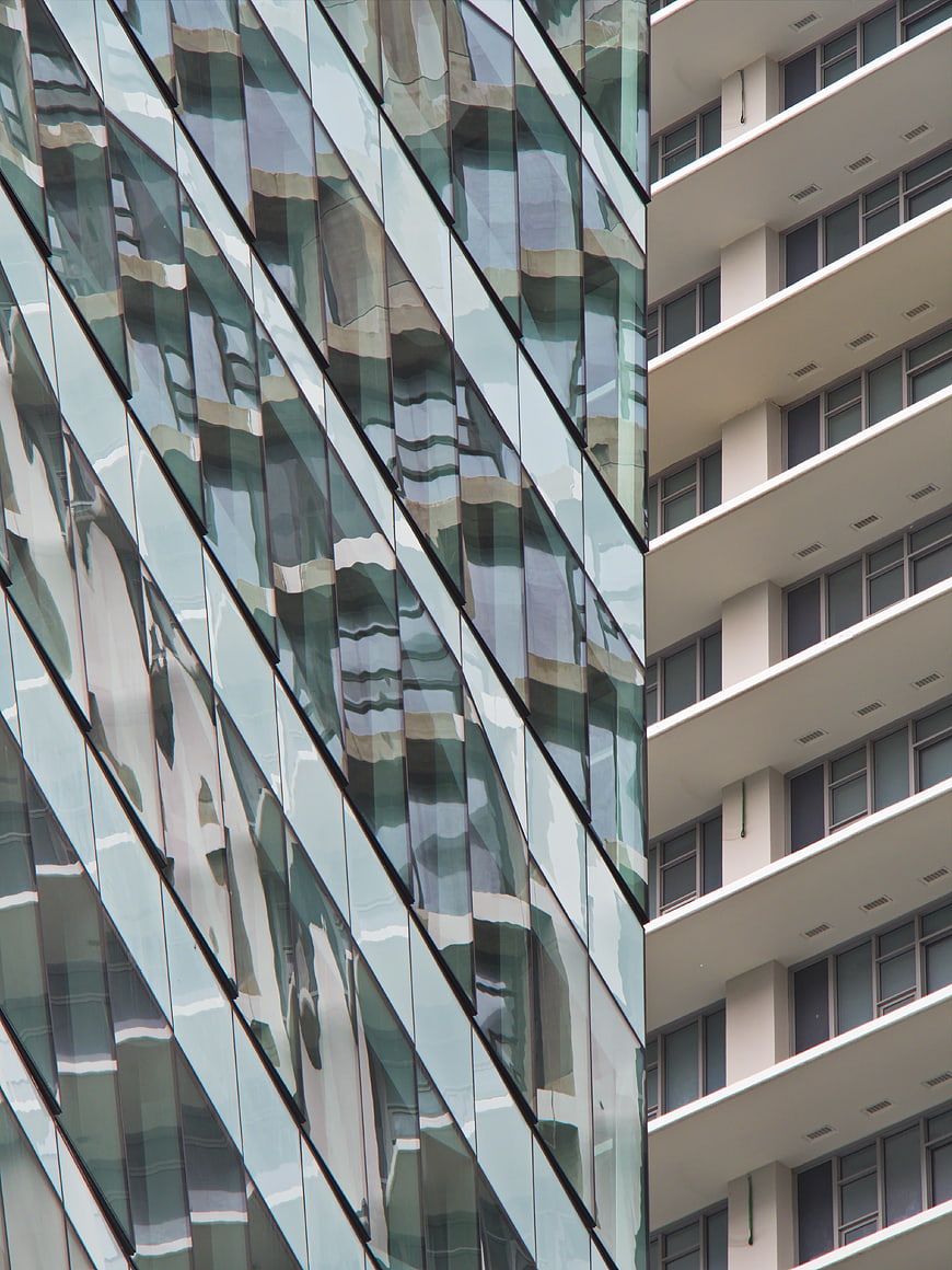 Modern Glass Building Facade with Abstract Reflections