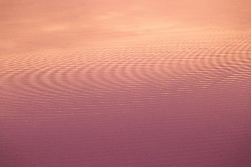 Abstract Pink and Orange Water Ripples Background