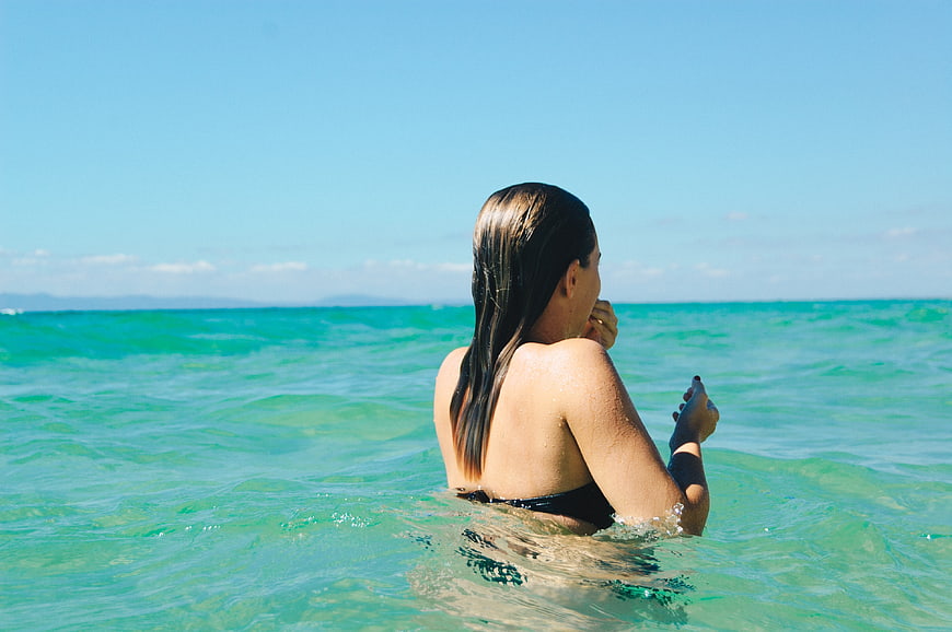 Woman Swimming in Turquoise Ocean Water