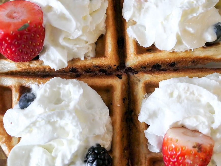 Close-up of Waffles with Whipped Cream and Fresh Berries