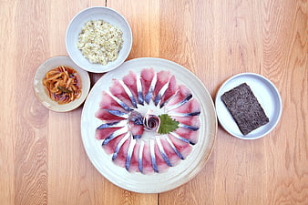 Japanese Sashimi Platter With Rice And Pickles On Wooden Table