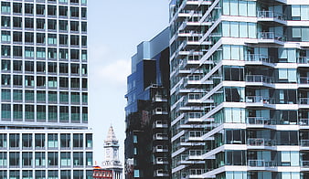 Modern Glass Skyscrapers and Historic Clock Tower