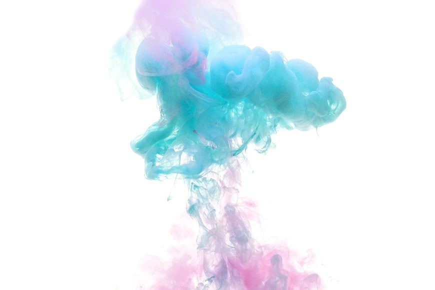 Pastel Pink And Cyan Ink Swirls In Water On White Background