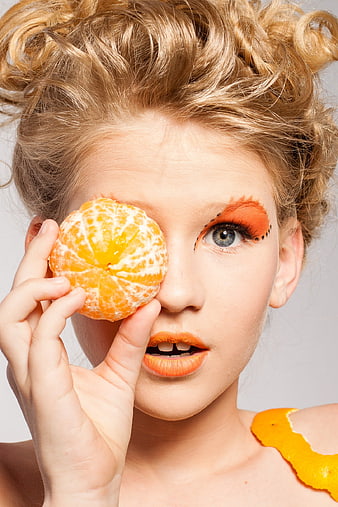 Creative Portrait of Woman with Mandarin Orange Eye Makeup