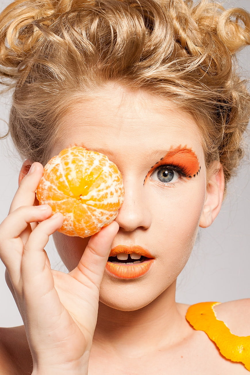 Creative Portrait of Woman with Mandarin Orange Eye Makeup