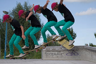 Sequence of young boy skateboarding trick at outdoor park