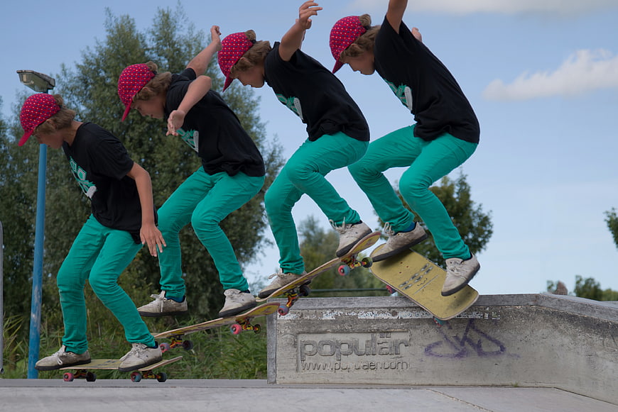 Sequence of young boy skateboarding trick at outdoor park