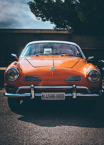 Front view of classic orange Volkswagen Karmann Ghia