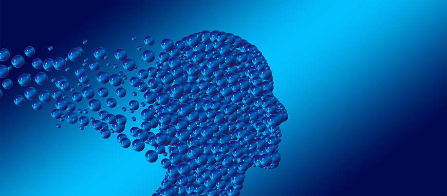Blue 3D Head Dissolving into Spheres Concept
