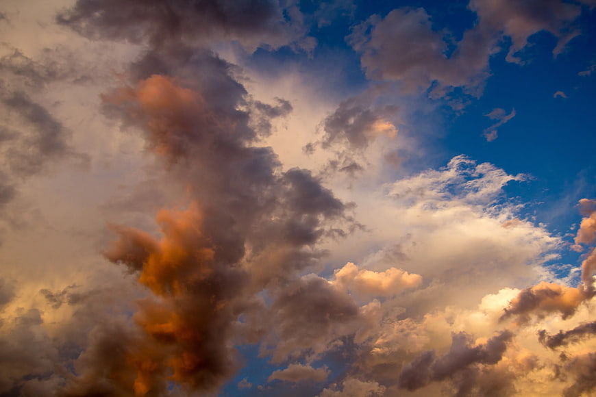 Dramatic sunset clouds with golden and blue sky