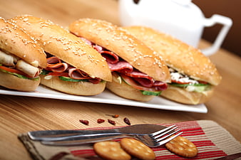 Fresh Sandwiches With Salami And Vegetables On Wooden Table