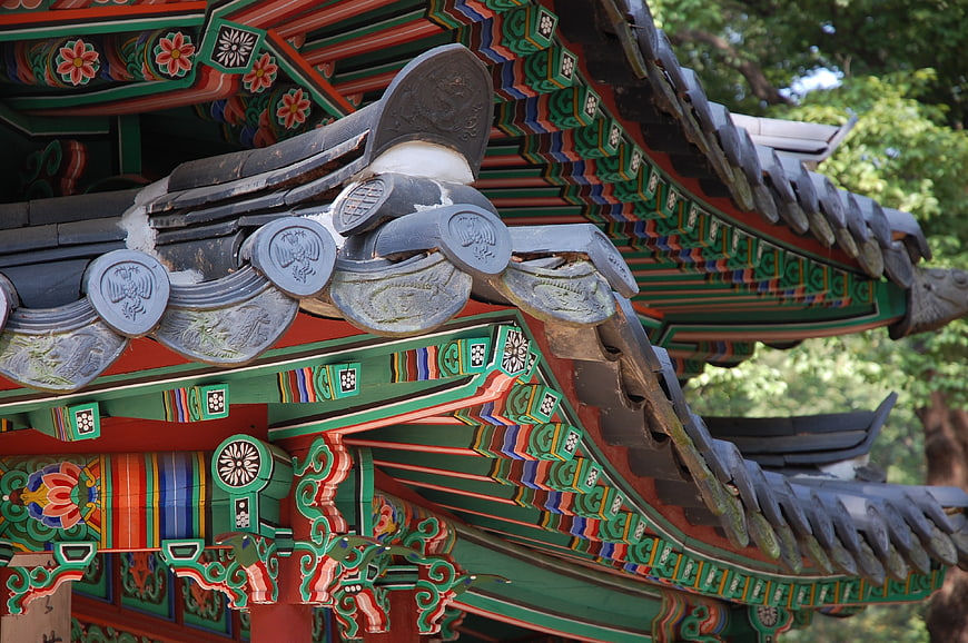 Traditional Korean Palace Roof Detail With Intricate Painted Woodwork