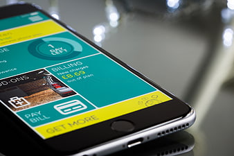 Close-up of smartphone displaying mobile billing app interface