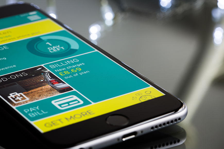 Close-up of smartphone displaying mobile billing app interface