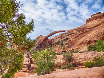 Natural sandstone arch in red rock desert landscape