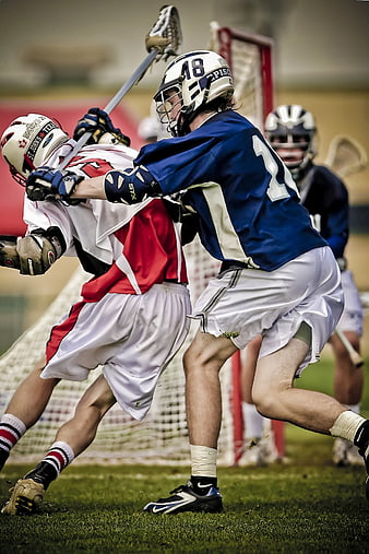 Lacrosse players battling for position on the field