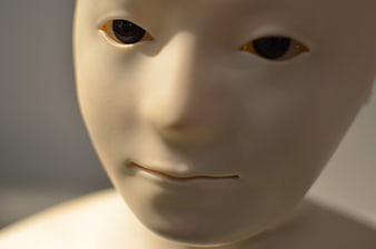 Close-up of a humanoid robot face with realistic features